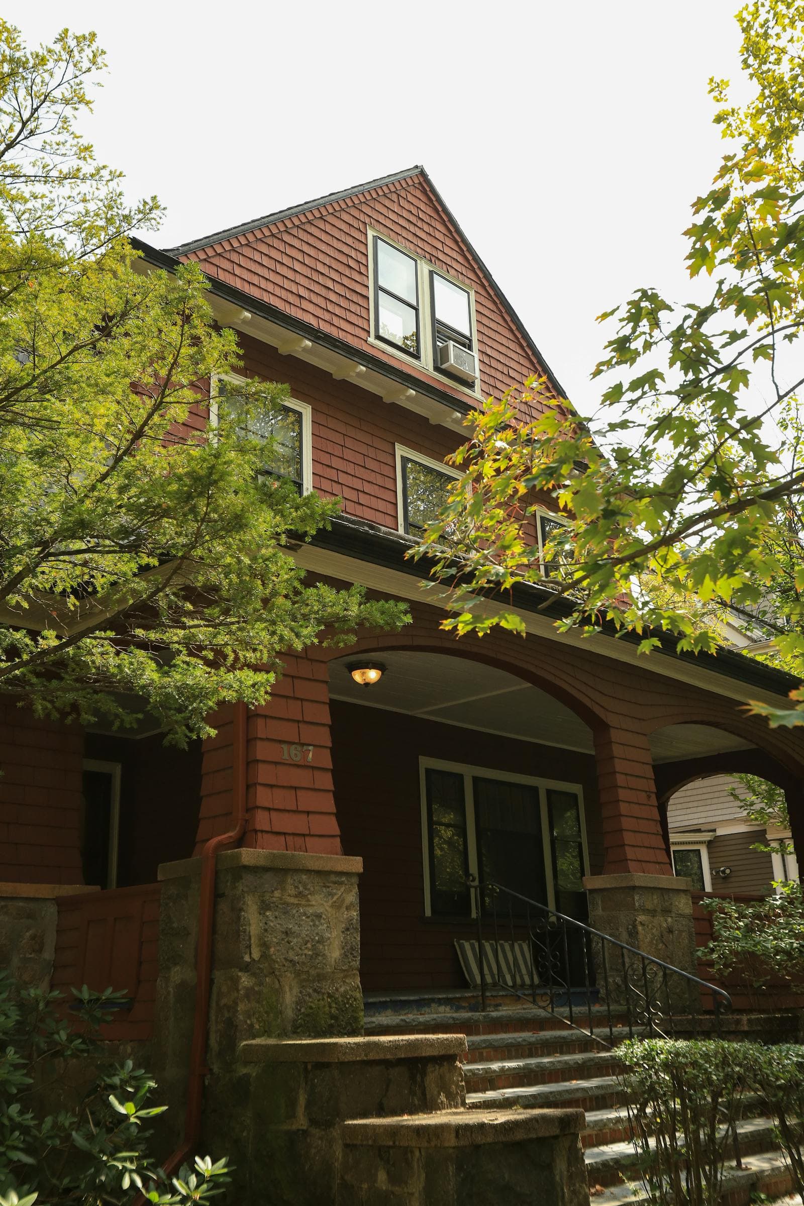 Older Sacramento craftsman bungalow with original siding, double-hung windows, and front porch in East Sacramento, Land Park, or Curtis Park